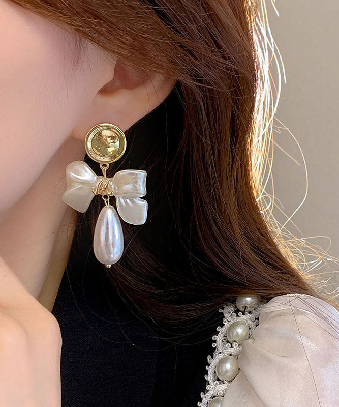 Fashion White Copper Alloy Pearl Bow Drop Earrings