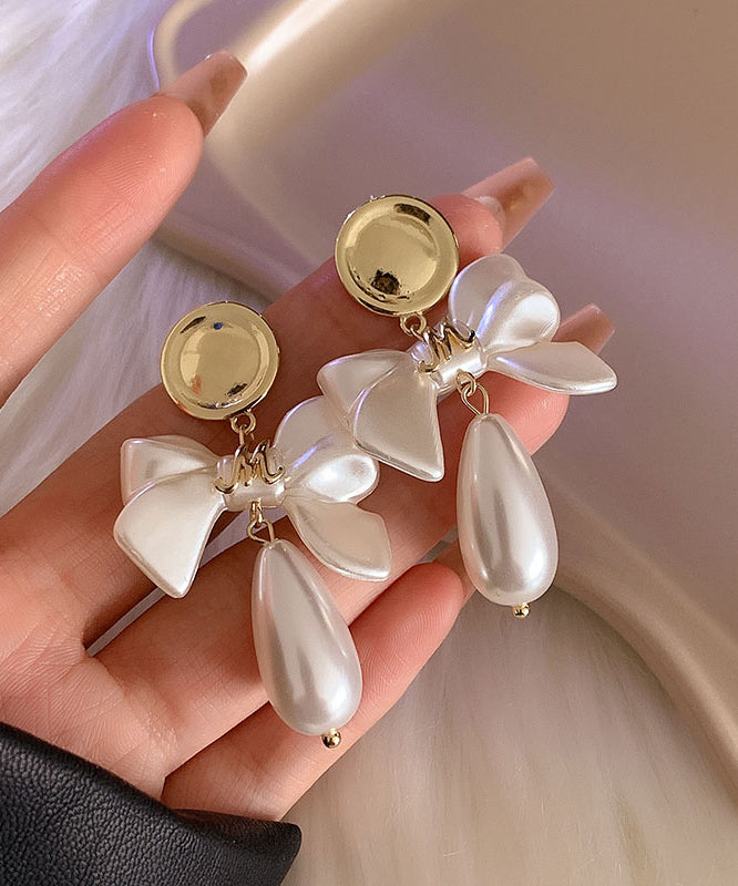 Fashion White Copper Alloy Pearl Bow Drop Earrings