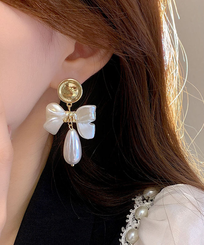Fashion White Copper Alloy Pearl Bow Drop Earrings