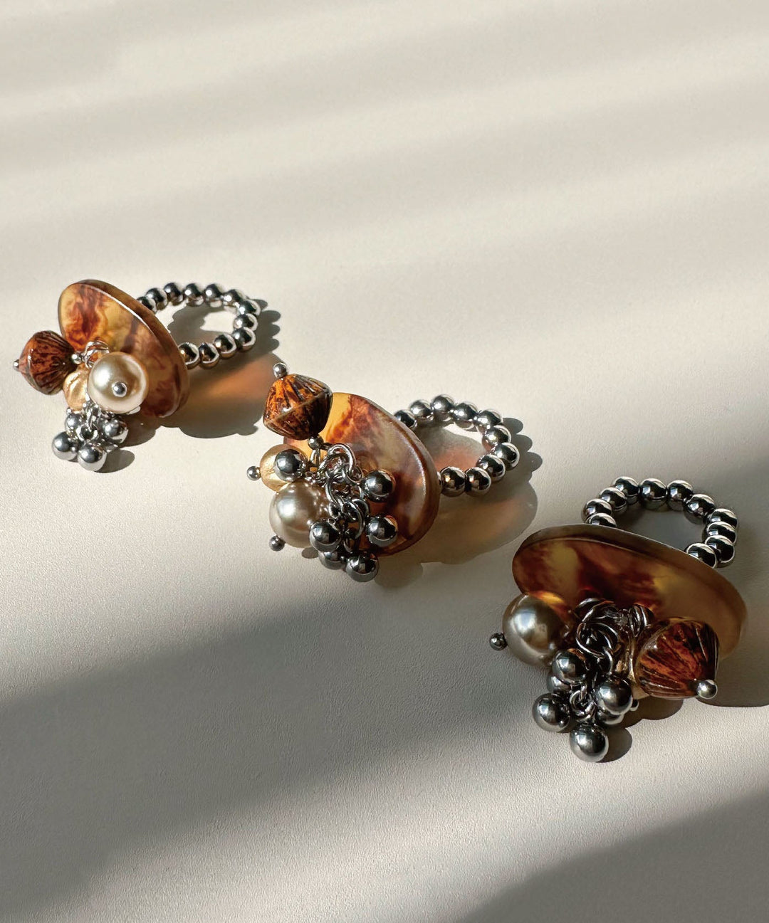 Stylish Brown Tassel Bead Glazed Titanium Steel Rings